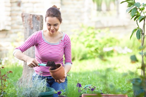 Homeowner cleaning deck in Enfield Lock with eco-friendly products